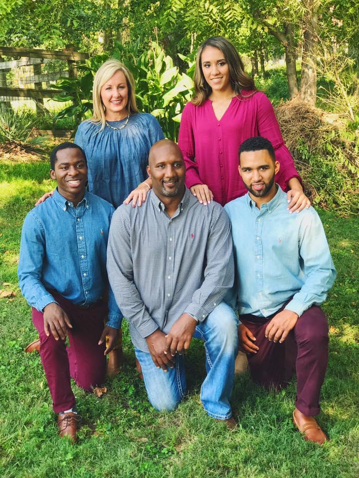 Anthony and his adopted family. Coach James Brewer and his wife, Debbie, opened their home to Anthony, inviting him to become a member of the Brewer family.